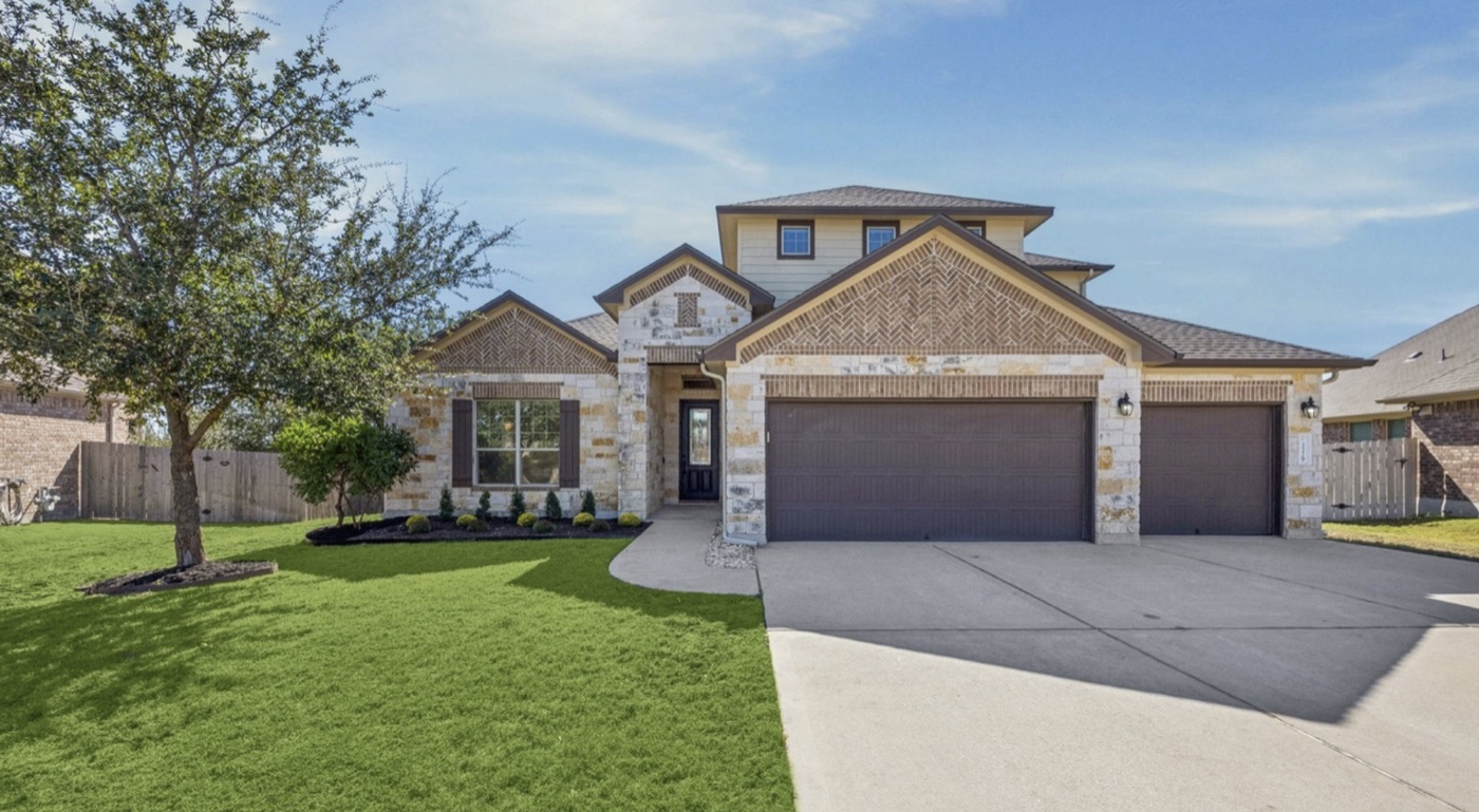 A stone-and-brick Texas suburban home — the kind of property Armor acquires every day